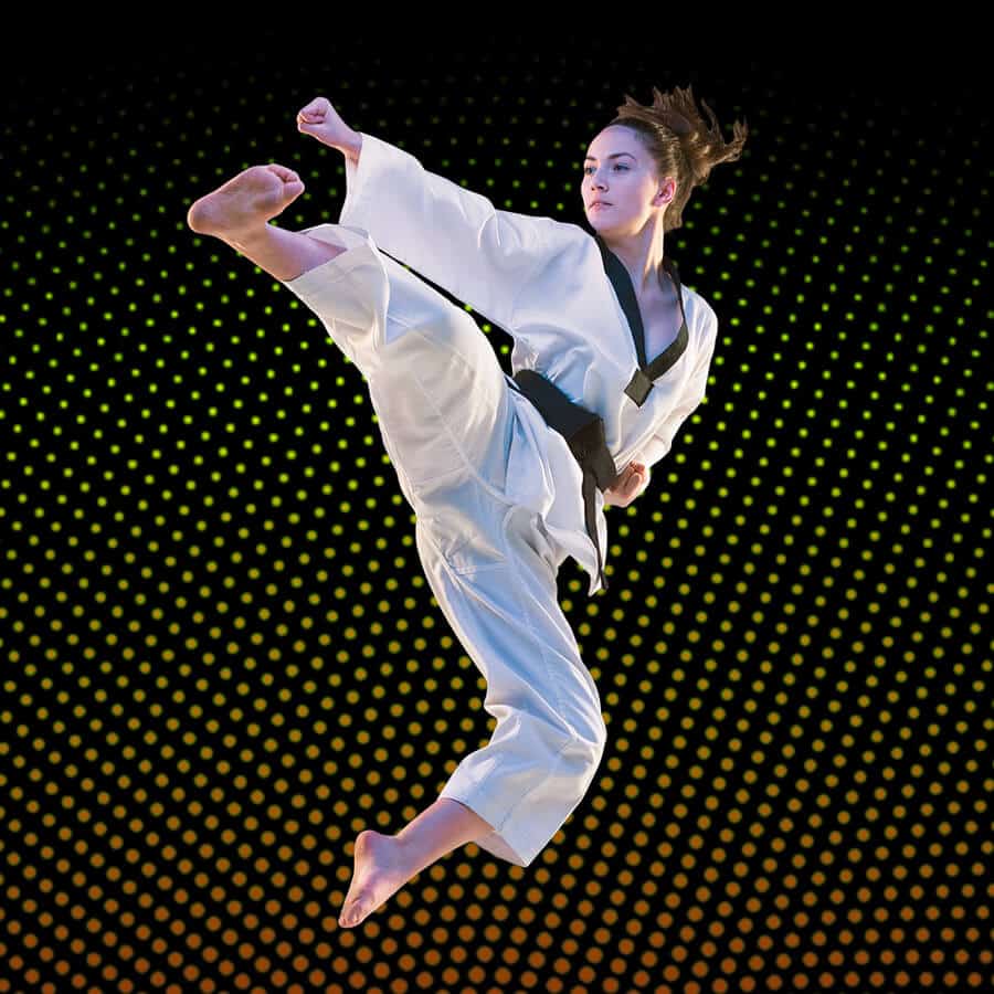 Martial Arts Lessons for Adults in hohokus NJ - Girl Black Belt Jumping High Kick